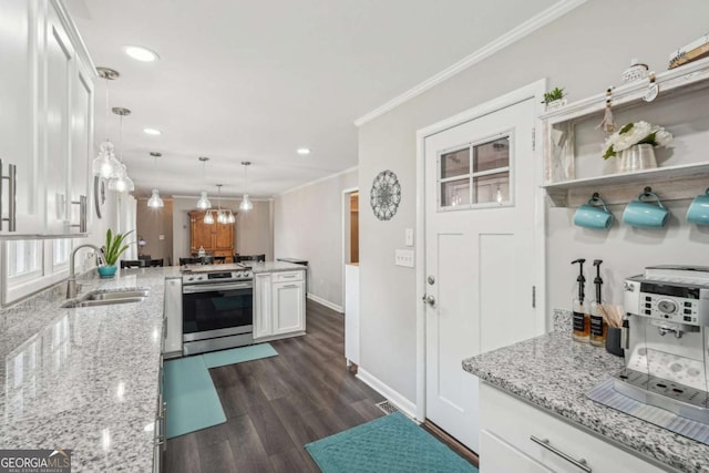 156 Sims St, Winder, GA 30680 - kitchen with stainless steel electric range oven, a sink, white cabinets, crown molding, and recessed lighting