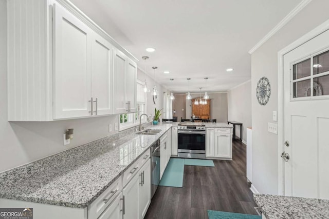 156 Sims St, Winder, GA 30680 - kitchen with appliances with stainless steel finishes, a peninsula, a sink, white cabinetry, and recessed lighting