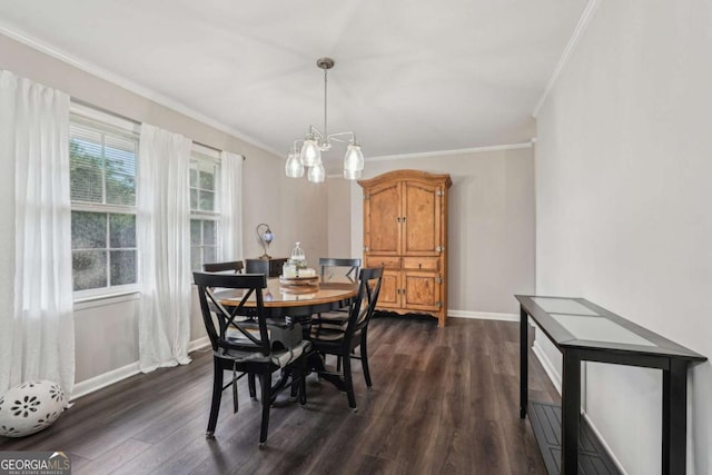 156 Sims St, Winder, GA 30680 - dining space featuring crown molding, dark wood-type flooring, a chandelier, and baseboards