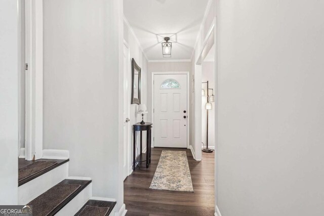 156 Sims St, Winder, GA 30680 - entryway featuring dark wood finished floors, baseboards, and ornamental molding