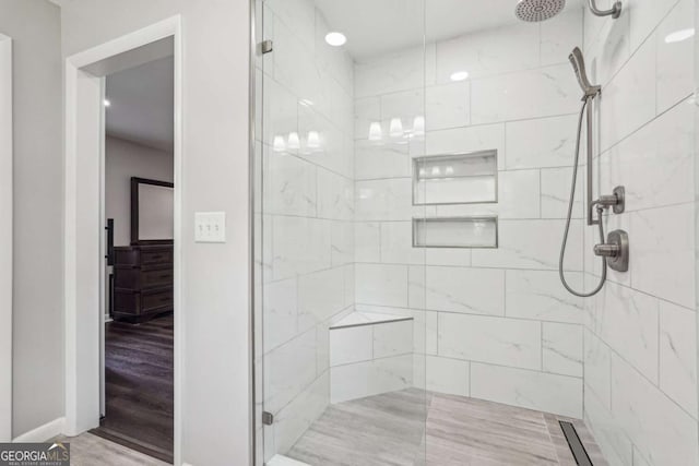 156 Sims St, Winder, GA 30680 - bathroom featuring a shower stall, wood finished floors, and baseboards
