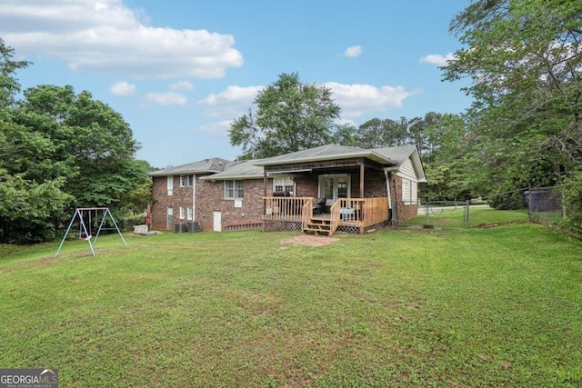 156 Sims St, Winder, GA 30680 - back of property with a gate, a wooden deck, and brick siding