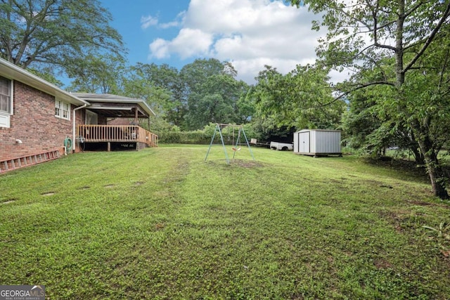 156 Sims St, Winder, GA 30680 - view of green lawn with a wooden deck