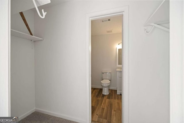 3645 Ten Oaks Cir, Powder Springs, GA 30127 - walk in closet with wood finished floors