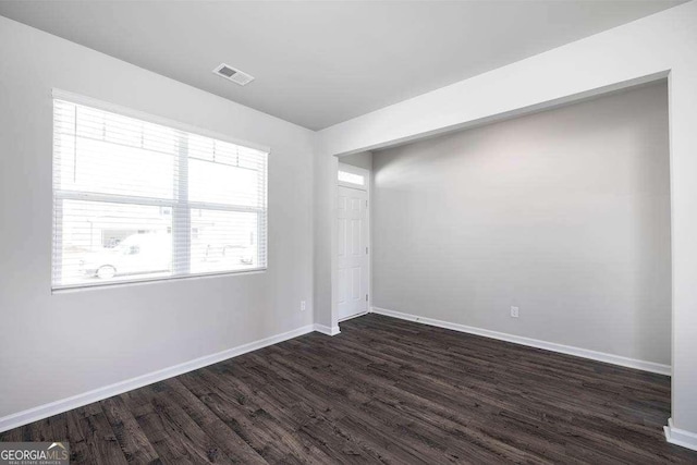 609 Lobelia Way, Locust Grove, GA 30248 - empty room featuring dark wood finished floors and baseboards