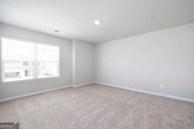 609 Lobelia Way, Locust Grove, GA 30248 - spare room featuring carpet and baseboards