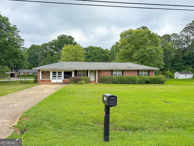 5141 Hiram Lithia Springs Rd, Powder Springs, GA 30127 - ranch-style house featuring brick siding, concrete driveway, and a front yard