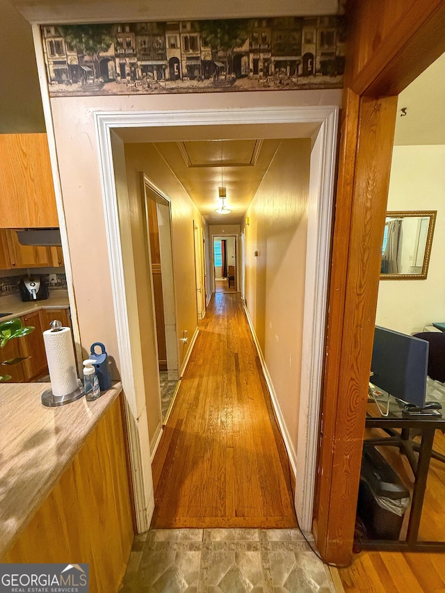5141 Hiram Lithia Springs Rd, Powder Springs, GA 30127 - hallway with attic access, light wood finished floors, and a desk