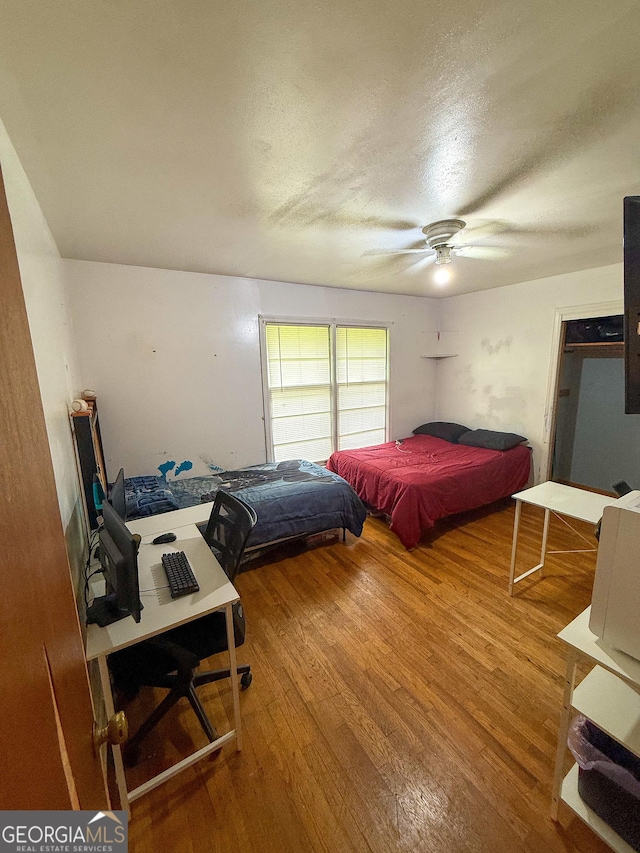 5141 Hiram Lithia Springs Rd, Powder Springs, GA 30127 - bedroom featuring wood finished floors, a textured ceiling, and ceiling fan