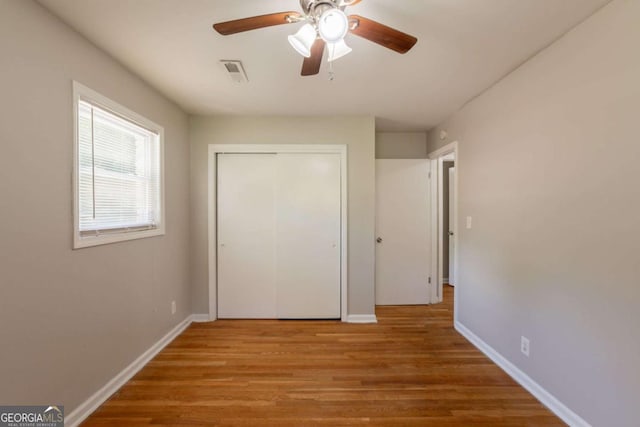 4345 Kimball Rd SW, Atlanta, GA 30331 - unfurnished bedroom with wood finished floors, a closet, and ceiling fan