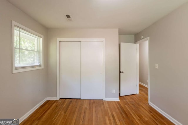 4345 Kimball Rd SW, Atlanta, GA 30331 - unfurnished bedroom with wood finished floors and a closet