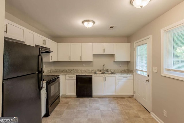 4345 Kimball Rd SW, Atlanta, GA 30331 - kitchen with black appliances, white cabinets, and ventilation hood
