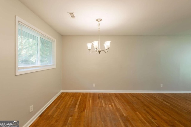 4345 Kimball Rd SW, Atlanta, GA 30331 - unfurnished room with a chandelier and wood finished floors