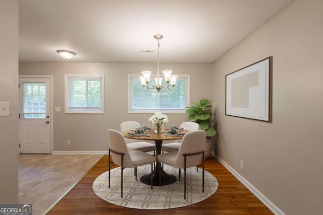 4345 Kimball Rd SW, Atlanta, GA 30331 - dining area featuring a chandelier and wood finished floors