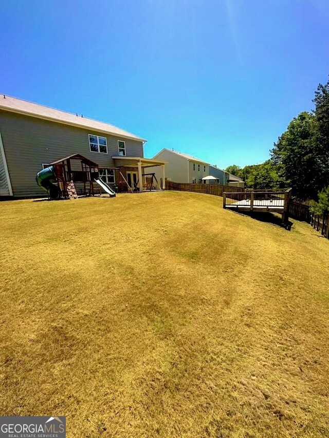 162 Cool Creek Ct, Dallas, GA 30132 - fenced backyard featuring a wooden deck