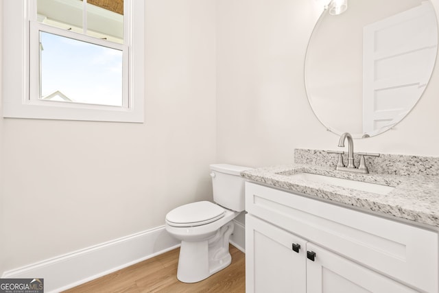401 Roper Dr, Clarkesville, GA 30523 - bathroom featuring vanity, toilet, wood finished floors, and baseboards