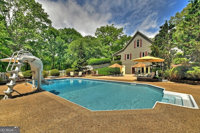270 Stone Ln, Blue Ridge, GA 30513 - swimming pool with a patio, a water slide, and view of wooded area