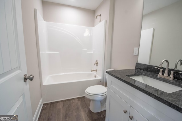 628 Grove St, Barnesville, GA 30204 - full bathroom with vanity, wood finished floors, toilet, and shower / tub combination