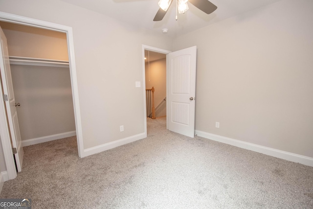 628 Grove St, Barnesville, GA 30204 - unfurnished bedroom featuring carpet floors, baseboards, a closet, and ceiling fan