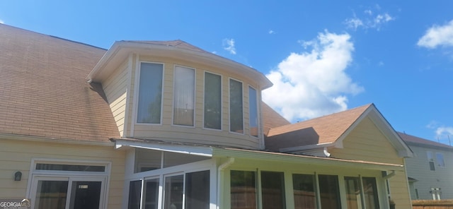 7314 Basalt Dr, Union City, GA 30291 - view of side of home featuring a sunroom and a shingled roof