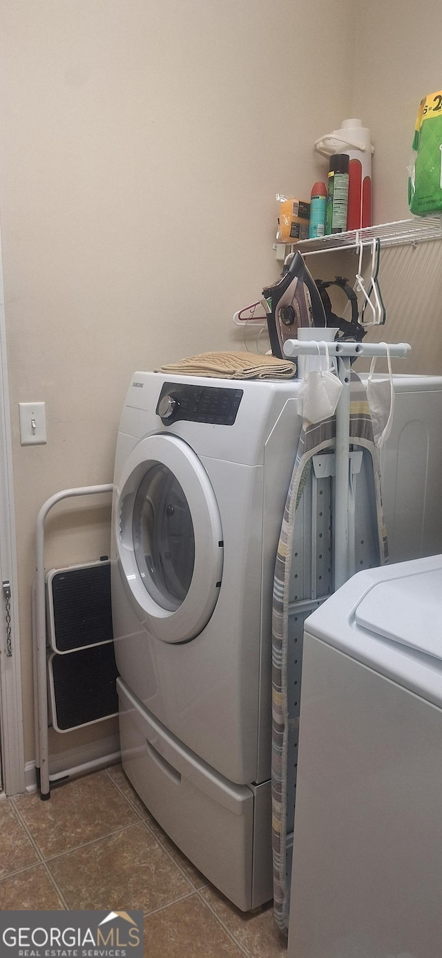 7314 Basalt Dr, Union City, GA 30291 - washroom featuring washing machine and clothes dryer and tile patterned flooring