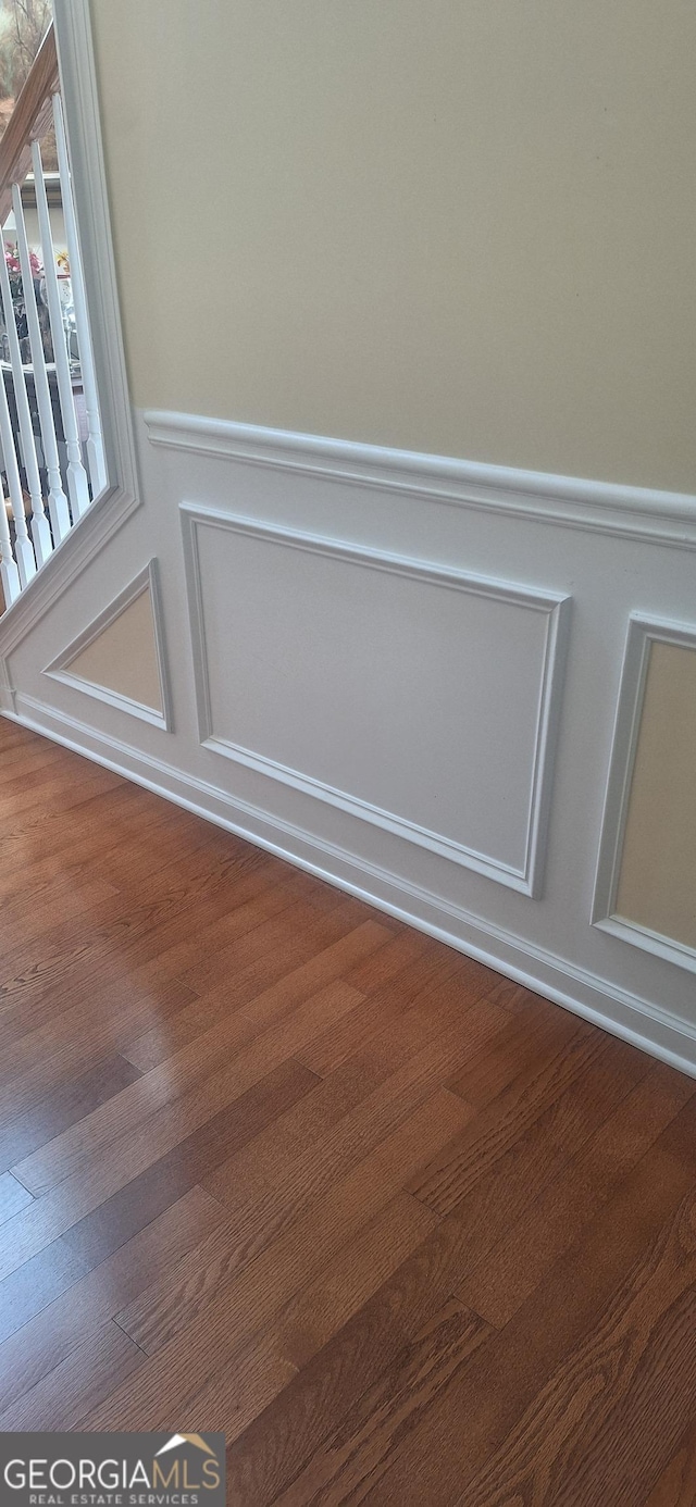 7314 Basalt Dr, Union City, GA 30291 - detailed view of wainscoting, wood finished floors, and a decorative wall