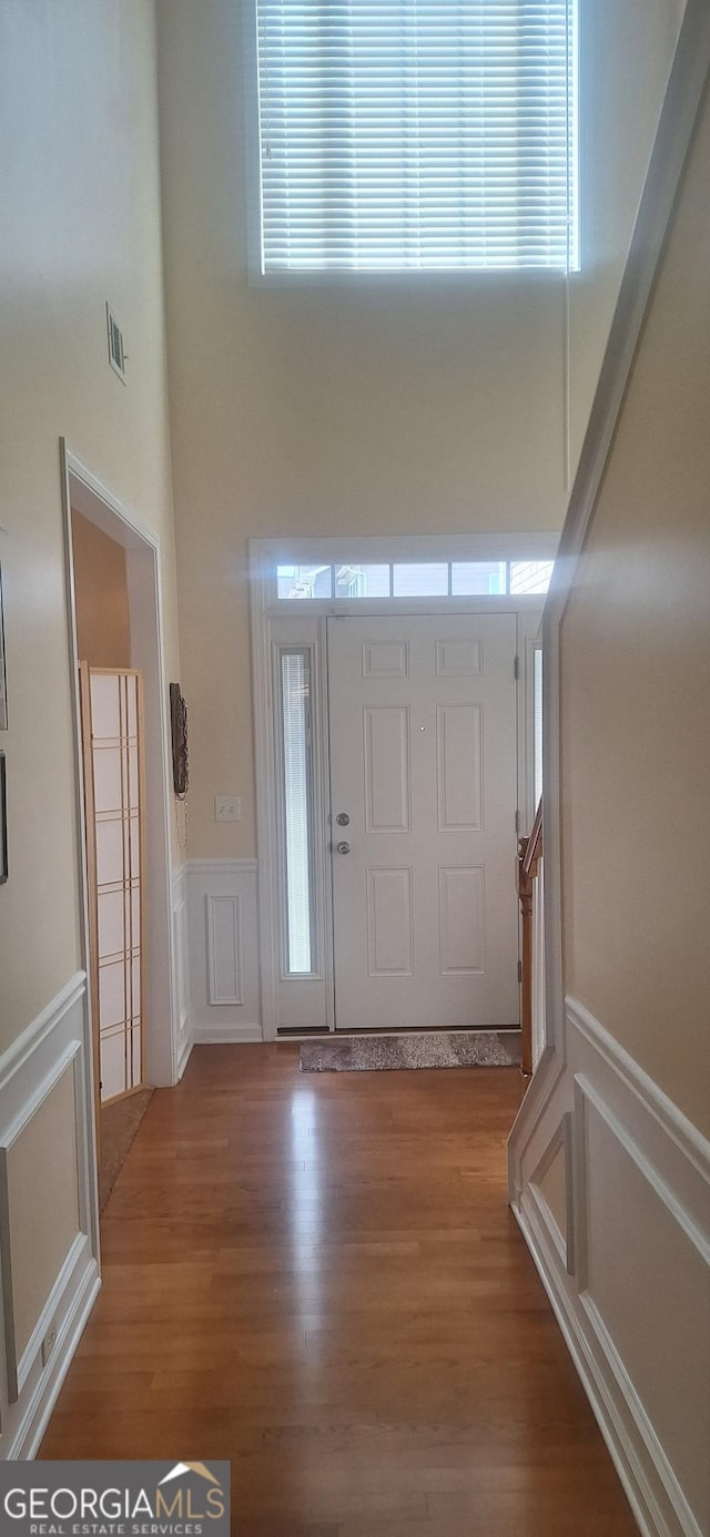 7314 Basalt Dr, Union City, GA 30291 - entryway with a decorative wall, a wainscoted wall, and wood finished floors
