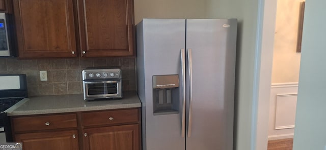 7314 Basalt Dr, Union City, GA 30291 - kitchen with appliances with stainless steel finishes, decorative backsplash, and light countertops