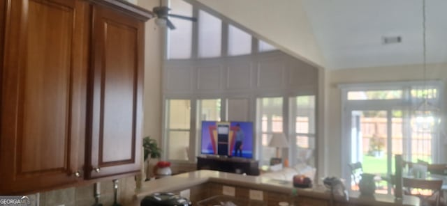 7314 Basalt Dr, Union City, GA 30291 - kitchen with brown cabinets, healthy amount of natural light, and ceiling fan
