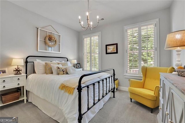 3330 Riverwalk Way, Cumming, GA 30040 - bedroom with a chandelier, light carpet, and baseboards