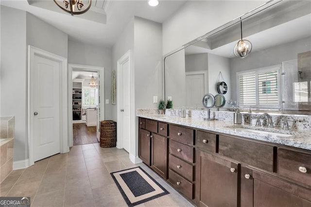 3330 Riverwalk Way, Cumming, GA 30040 - bathroom featuring a chandelier, double vanity, tile patterned flooring, a shower, and baseboards