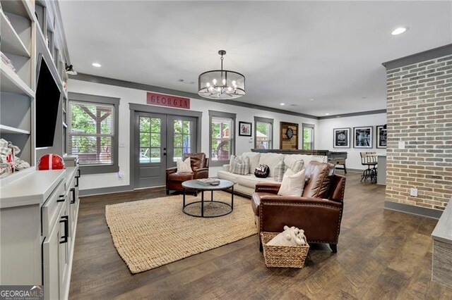 3330 Riverwalk Way, Cumming, GA 30040 - living room featuring a chandelier, recessed lighting, dark wood-style floors, baseboards, and crown molding