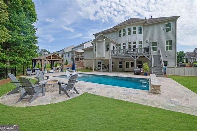 3330 Riverwalk Way, Cumming, GA 30040 - view of swimming pool featuring an outdoor fire pit, a gazebo, a deck, stairway, and a patio
