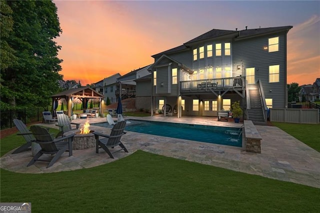 3330 Riverwalk Way, Cumming, GA 30040 - rear view of house with a fire pit, a gazebo, stairway, a deck, and a patio area