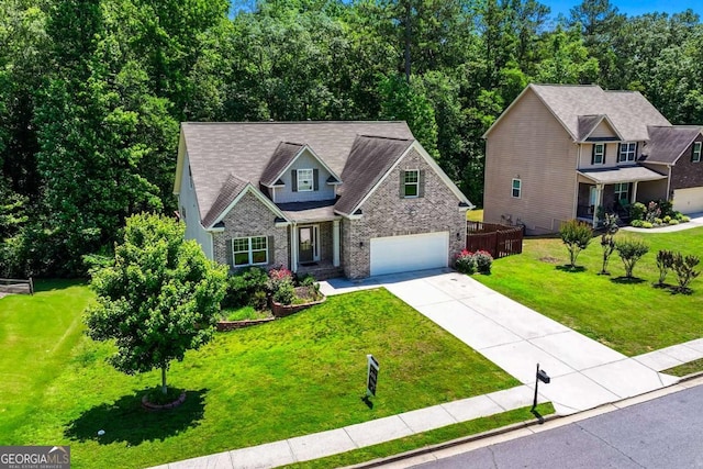 350 Paces Dr, Lithia Springs, GA 30122 - craftsman house featuring driveway, a garage, a front lawn, and brick siding