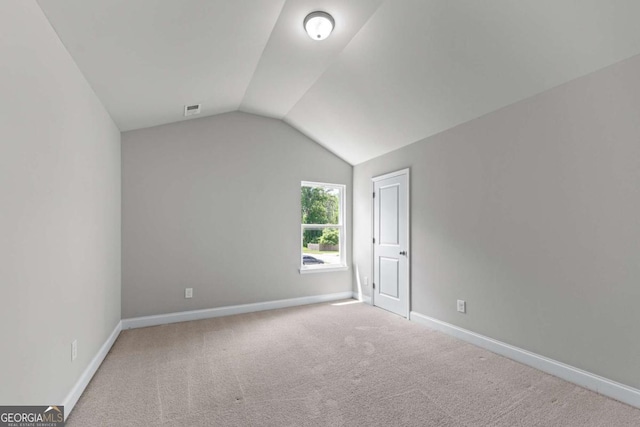 350 Paces Dr, Lithia Springs, GA 30122 - additional living space with vaulted ceiling, carpet flooring, and baseboards