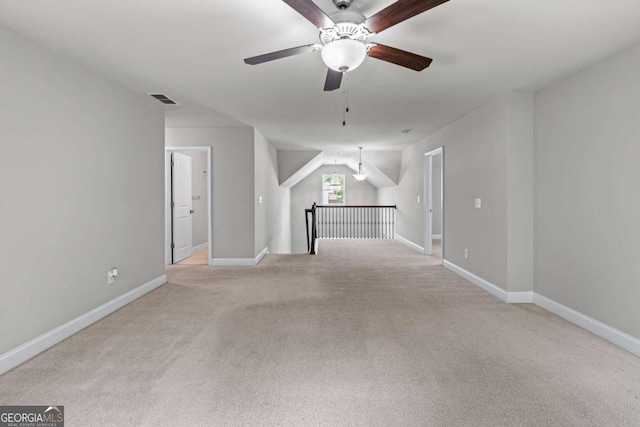 350 Paces Dr, Lithia Springs, GA 30122 - unfurnished room featuring a ceiling fan, light colored carpet, and baseboards