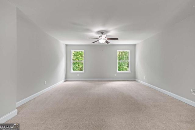 350 Paces Dr, Lithia Springs, GA 30122 - unfurnished room with ceiling fan, healthy amount of natural light, baseboards, and light colored carpet