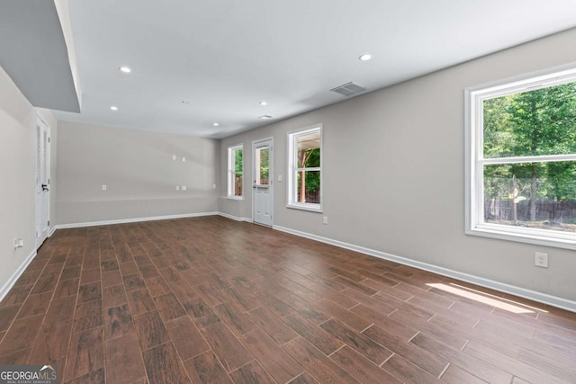 350 Paces Dr, Lithia Springs, GA 30122 - empty room featuring plenty of natural light, baseboards, wood finished floors, and recessed lighting