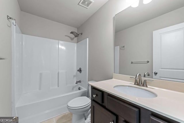 350 Paces Dr, Lithia Springs, GA 30122 - full bathroom featuring vanity, toilet, bathtub / shower combination, and tile patterned floors