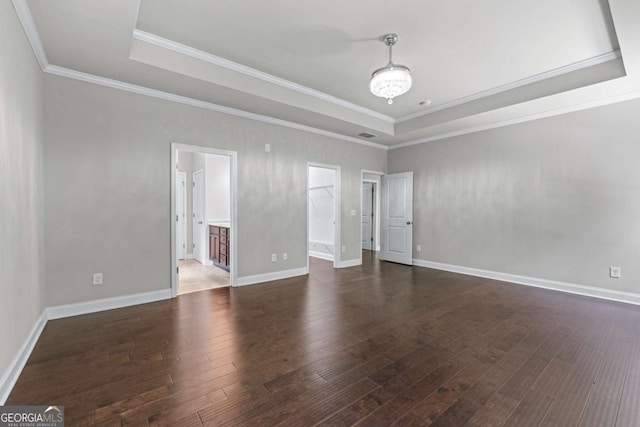 350 Paces Dr, Lithia Springs, GA 30122 - spare room with a tray ceiling, dark wood-style flooring, ornamental molding, and baseboards