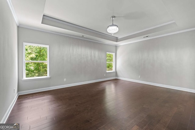 350 Paces Dr, Lithia Springs, GA 30122 - spare room with a raised ceiling, crown molding, dark wood-style flooring, and baseboards