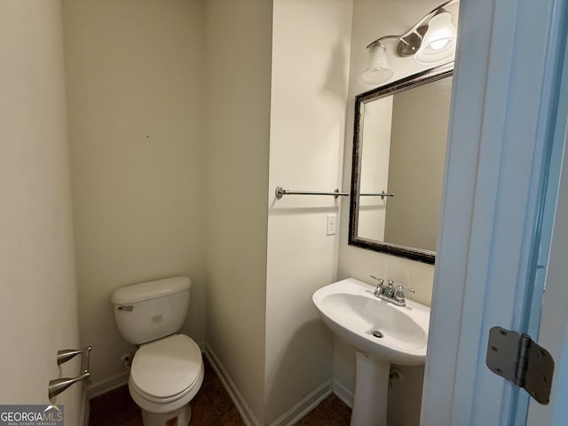 3389 Rosecliff Trce, Buford, GA 30519 - half bathroom featuring toilet and baseboards
