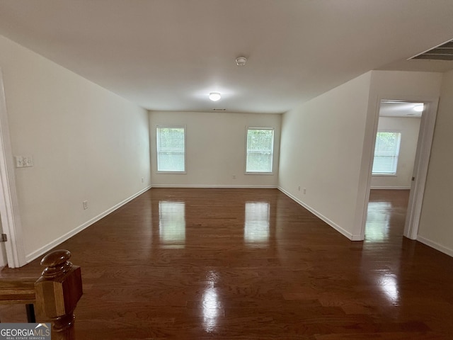 3389 Rosecliff Trce, Buford, GA 30519 - unfurnished room with wood finished floors, baseboards, and a smoke detector