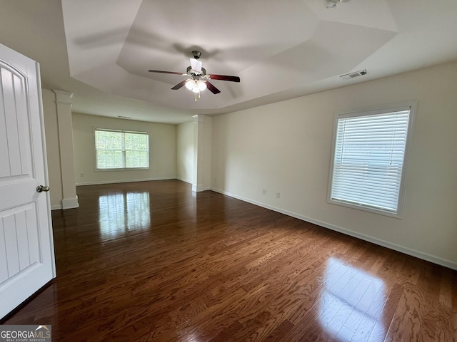 3389 Rosecliff Trce, Buford, GA 30519 - empty room with a raised ceiling, a ceiling fan, dark wood finished floors, and baseboards