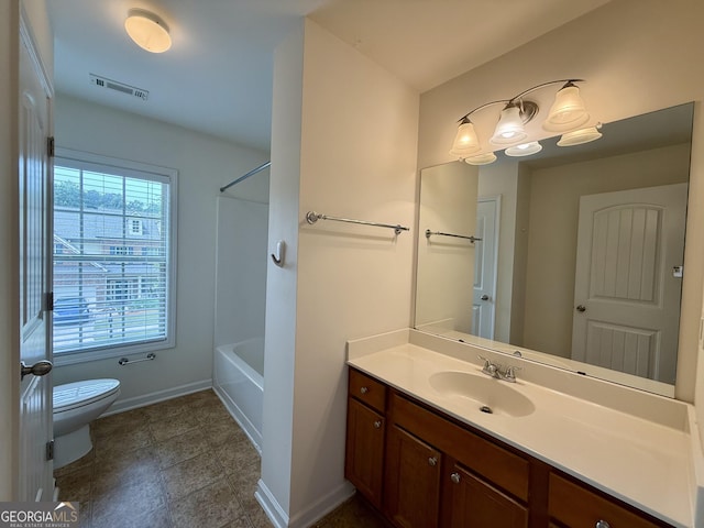 3389 Rosecliff Trce, Buford, GA 30519 - full bath featuring toilet, vanity, baseboards, and bathing tub / shower combination