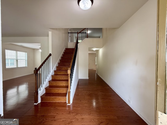 3389 Rosecliff Trce, Buford, GA 30519 - stairway with wood finished floors, a ceiling fan, and baseboards