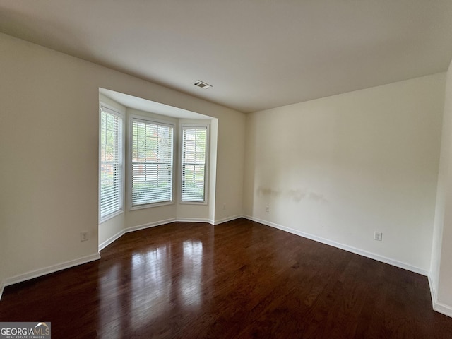 3389 Rosecliff Trce, Buford, GA 30519 - unfurnished room with dark wood-style floors and baseboards