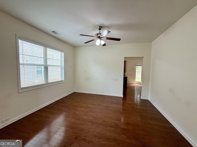 3389 Rosecliff Trce, Buford, GA 30519 - unfurnished room with wood finished floors, a ceiling fan, and baseboards