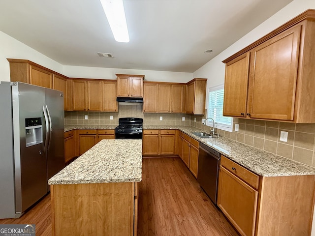 3389 Rosecliff Trce, Buford, GA 30519 - kitchen featuring appliances with stainless steel finishes, a sink, dark wood-style floors, and a kitchen island